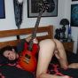 Sweet TS babe posing her goodies in bed with a guitar